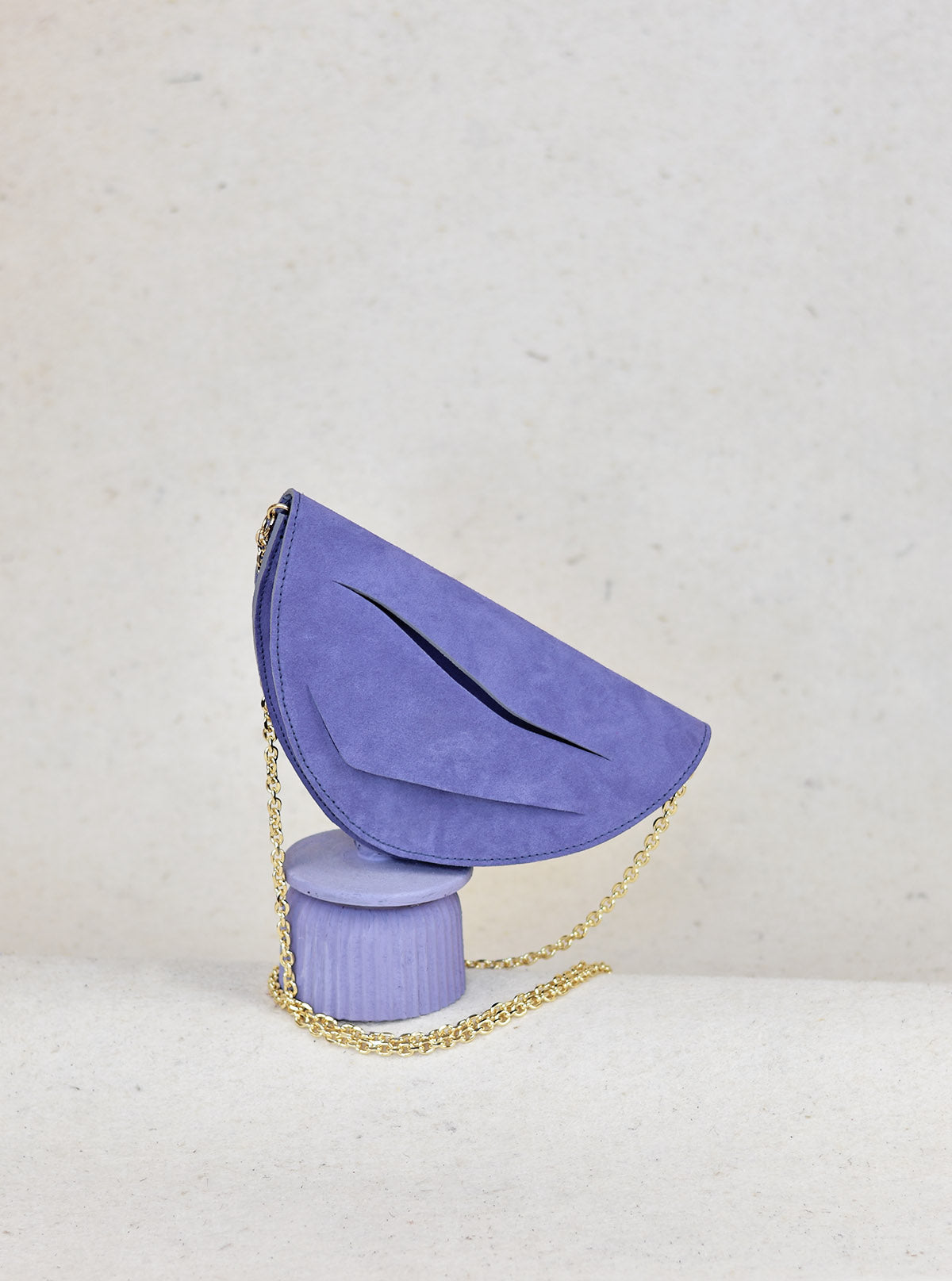Handmade clutch bag crafted from genuine Italian suede leather, lilac amethyst handbag, crossbody purse with unique wrist strap by Hungarian, Budapest based designer. Lila hasítottbőr designer borítéktáska, táska, magyar tervező márka.