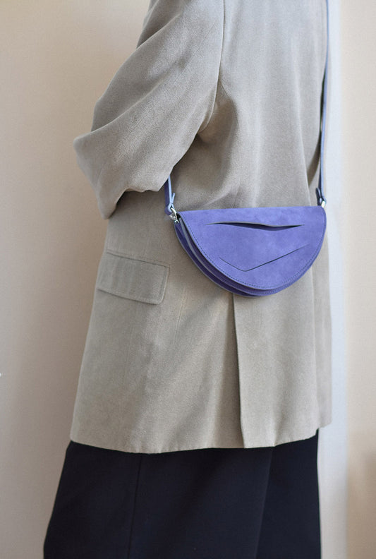 Handmade clutch bag crafted from genuine Italian suede leather, lilac amethyst handbag, crossbody purse with unique wrist strap by Hungarian, Budapest based designer. Lila hasítottbőr designer borítéktáska, táska, magyar tervező márka.