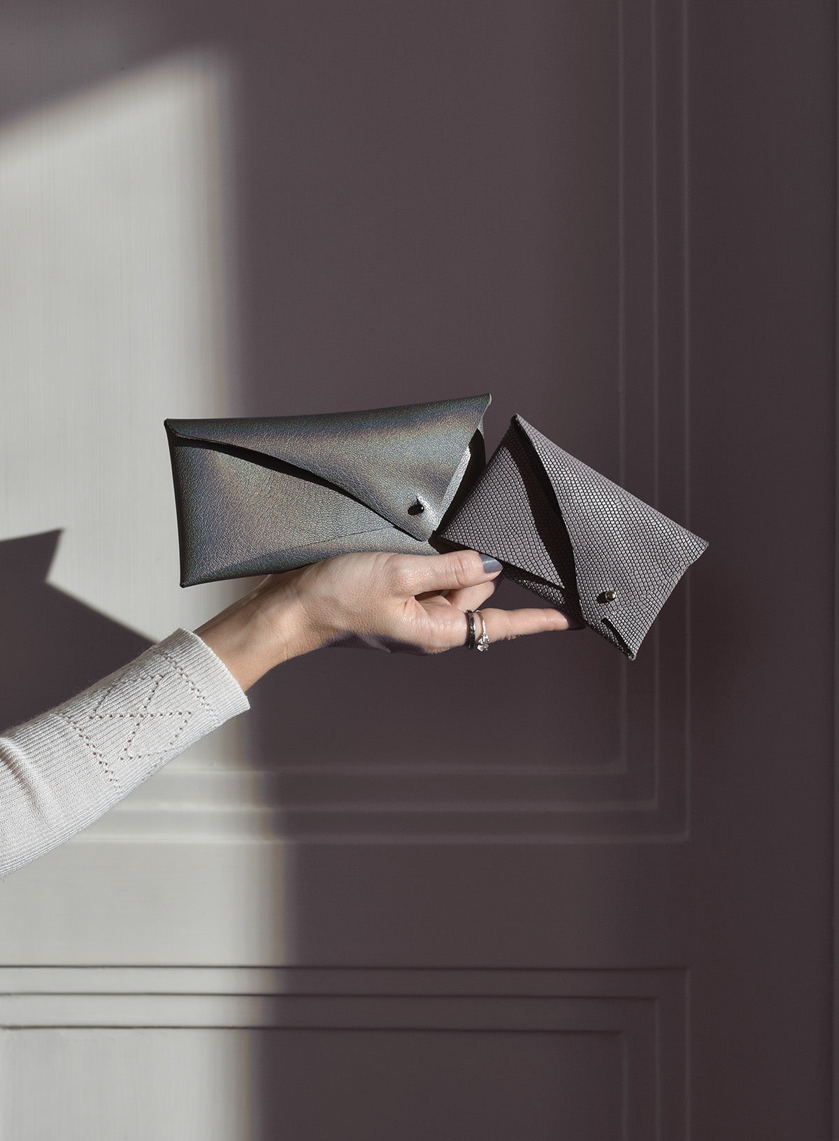 Womens designer leather cardholder wallets, a larger metallic grey with nebula color effect, and a mini taupe lilac.