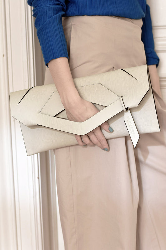 Handmade bridal, wedding clutch bag handcrafted from genuine Italian leather, or vegan custom colors, neutral, white handbag, with unique wrist strap by Hungarian, Budapest, EU based designer. Elegáns, fehér választható színű bőr designer menyasszonyi borítéktáska, táska, válltáska magyar táskatervező márka.