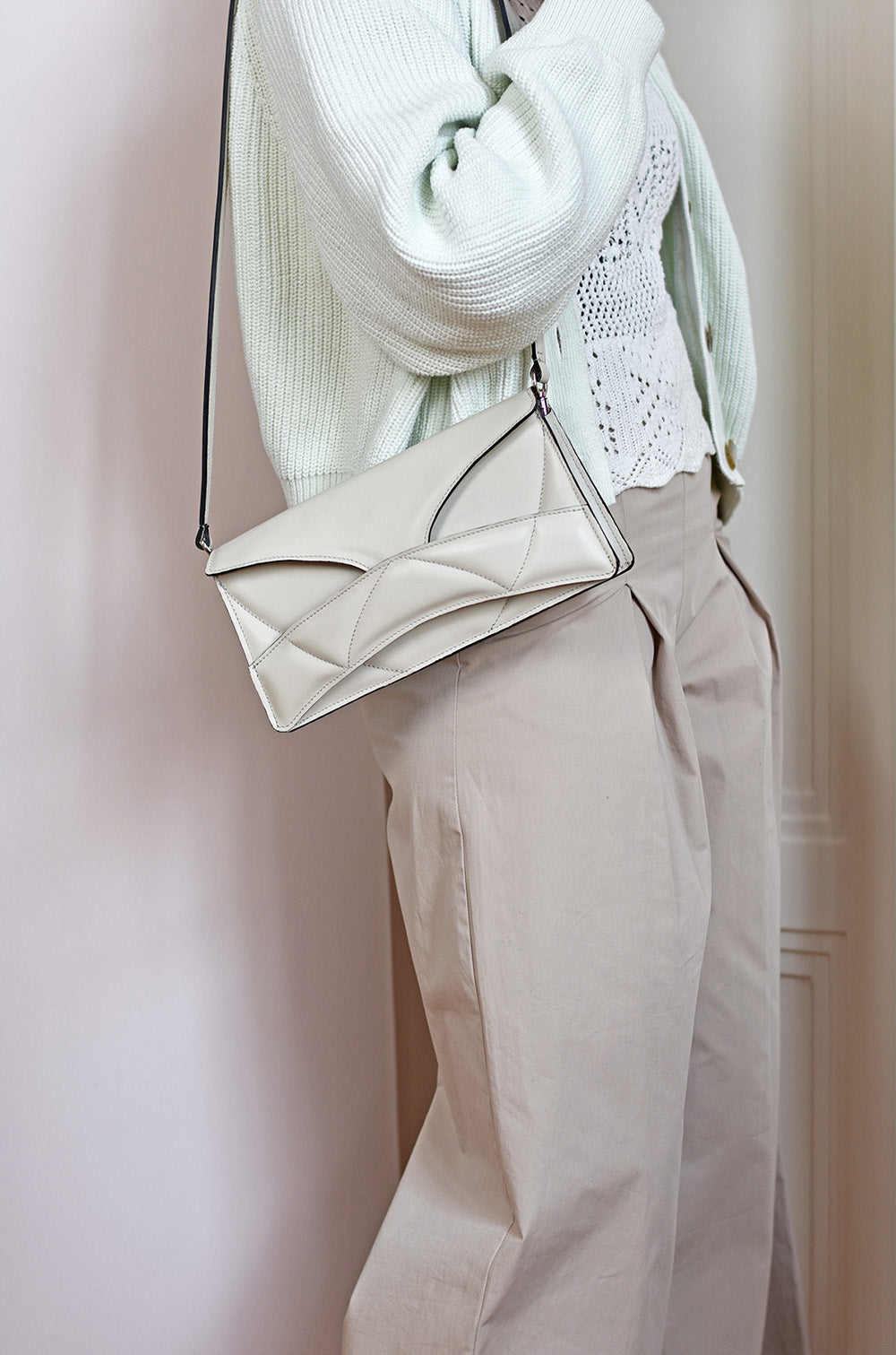 Handmade bridal, wedding clutch bag handcrafted from genuine Italian leather, or vegan custom colors, elegant, white handbag, crossbody purse with unique wrist strap by Hungarian, Budapest, EU based designer. Elegáns, fehér választható színű bőr designer borítéktáska, menyasszonyi táska, válltáska magyar táskatervező márka.