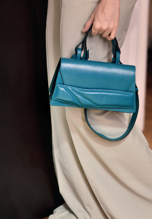 Lindasieto sculptural Mini Balance Bag in teal, green-blue leather, designer crossbody handbag crafted in Budapest.