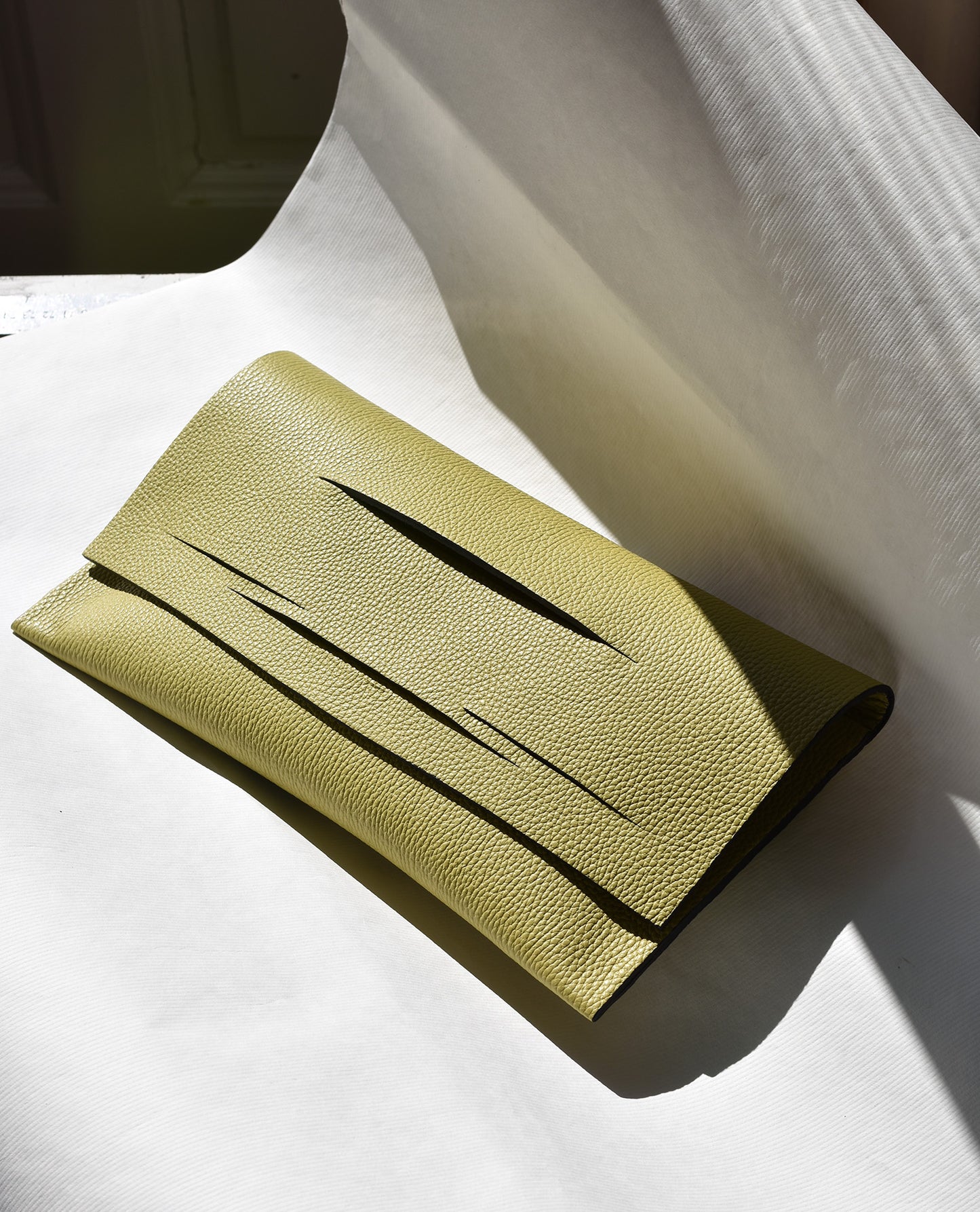 Diagonal Slashed Clutch - Size + Colour Options