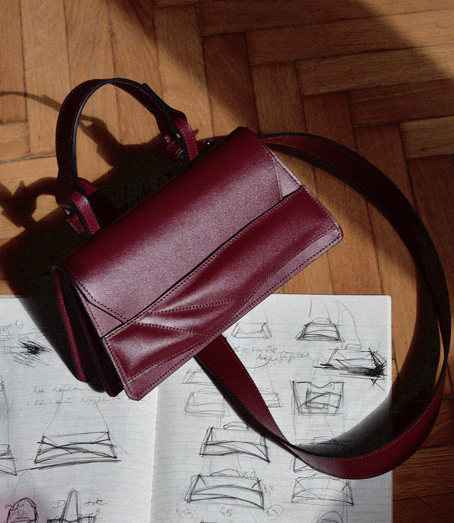 lindasieto Mini Balance Bag in dark cherry red leather, handcrafted sculptural minimalist top handle handbag and design sketches