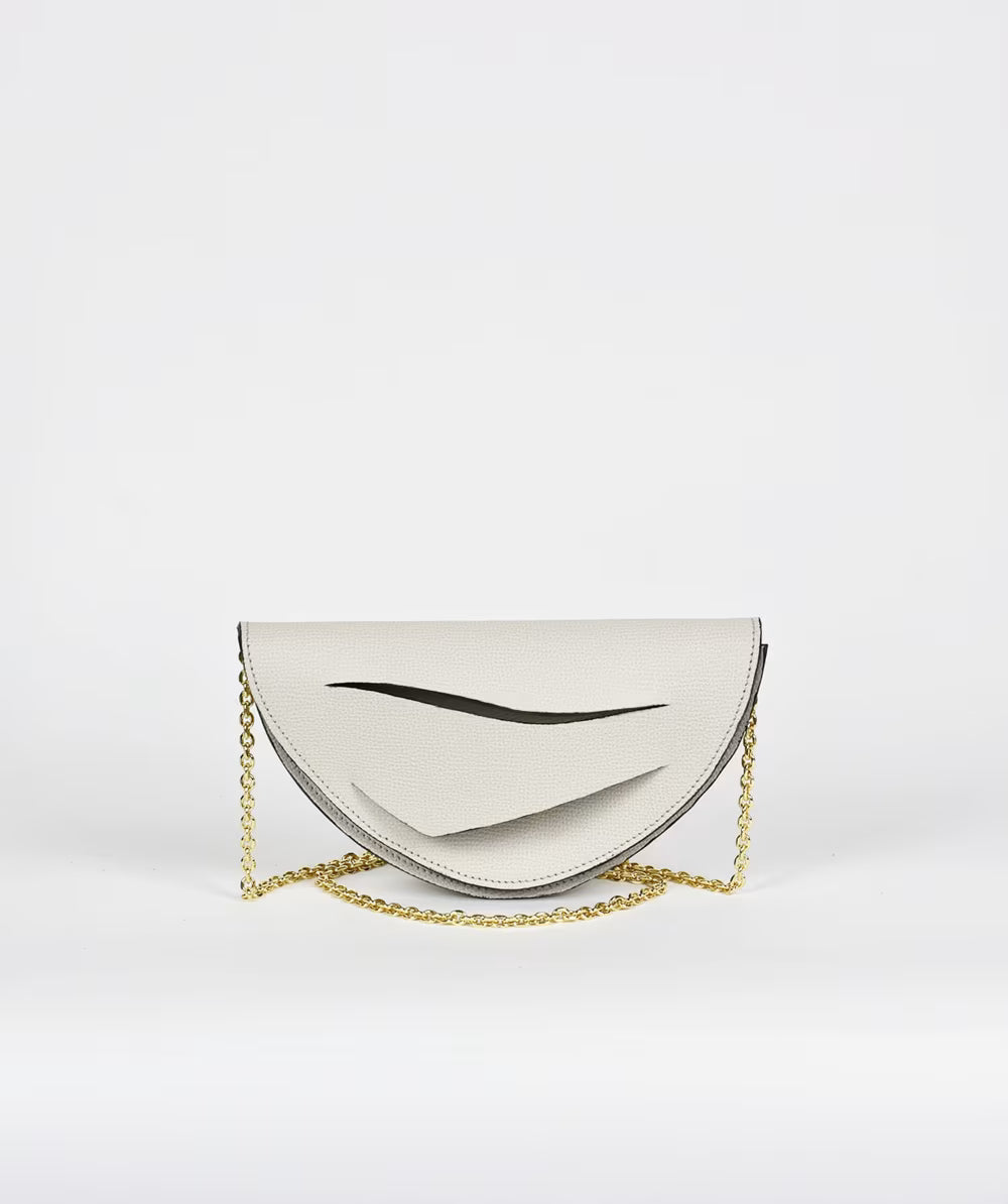 fehér designer bőr magyar clutch táska off_white_handbag_half moon crossbody_purse_with_unique_wrist_strap_by_Hungarian_Budapest_based