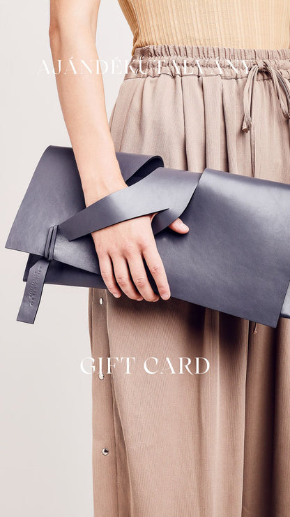Ajándékutalvány magyar designer bőr pénztárca, kártyatartó, boríték-válltáska, monogram, személyes felirat, iparművész tervező. Gift Cards for wallets to unique wrist strap leather or plant-based clutches, seen on Vogue, crossbody bags by Budapest based slow fashion brand. Personalized custom monogram/message on bags.