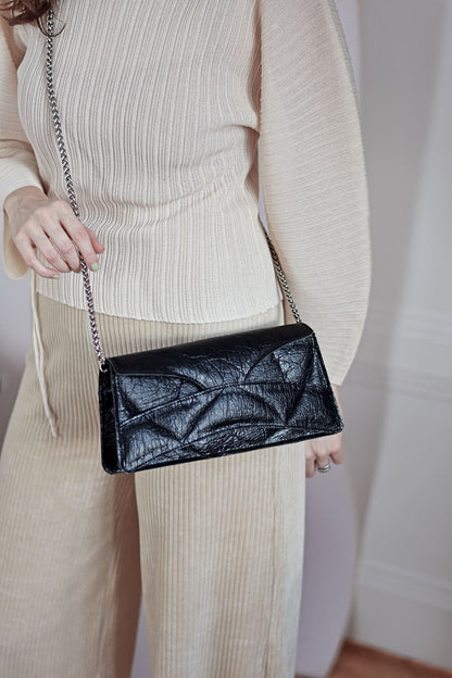 Handmade clutch bag handcrafted from genuine Italian leather, or vegan custom colors, black handbag, crossbody purse with unique wrist strap by Hungarian, Budapest based designer. Fekete, bordó választható színű bőr vegán designer borítéktáska, táska, válltáska magyar táskatervező márka.
