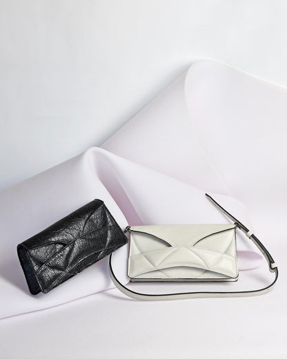 Handmade clutch bag handcrafted from genuine Italian leather, or vegan custom colors, black handbag, crossbody purse with unique wrist strap by Hungarian, Budapest based designer. Fekete, bordó választható színű bőr vegán designer borítéktáska, táska, válltáska magyar táskatervező márka.