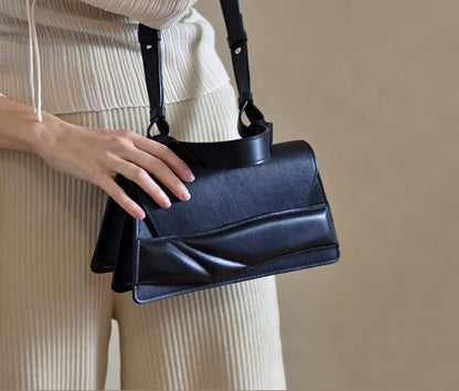 Lindasieto  structured black Mini Balance  designer bag, handcrafted from Italian leather, black handbag, crossbody purse with unique wrist strap by Budapest based independent designer. Magyar designer különleges egyedi bőr fekete táska, csukló pánt, női, uniszex válltáska, különleges színekben, személyre szabott felirattal, monogrammal, ajándék csomagolással, magyar tervező, márka.