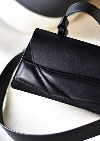 Lindasieto  structured black Mini Balance  designer bag, handcrafted from Italian leather, black handbag, crossbody purse with unique wrist strap by Budapest based independent designer. Magyar designer különleges egyedi bőr fekete táska, csukló pánt, női, uniszex válltáska, különleges színekben, személyre szabott felirattal, monogrammal, ajándék csomagolással, magyar tervező, márka.