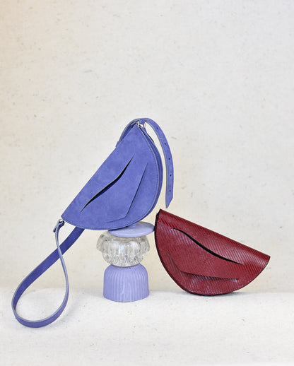 Lila hasított bőr designer borítéktáska, táska, magyar tervező márka. Handmade lilac clutch bag crafted from genuine Italian suede leather, purple amethyst purse, crossbody purse with unique wrist strap by Hungarian, Budapest based designer.