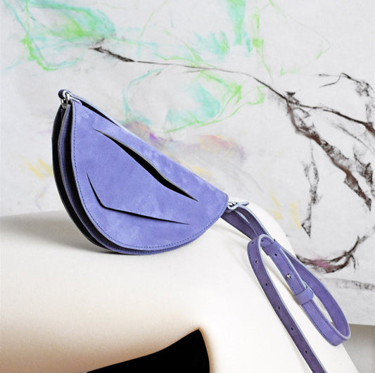Handmade clutch bag crafted from genuine Italian suede leather, lilac amethyst handbag, crossbody purse with unique wrist strap by Hungarian, Budapest based designer. Lila hasítottbőr designer borítéktáska, táska, magyar tervező márka.