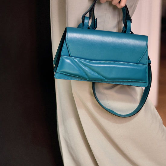 Lindasieto sculptural Mini Balance Bag in teal, green-blue leather, designer crossbody handbag crafted in Budapest.