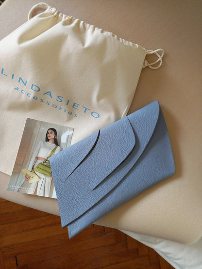 Handmade neutral grey blue genuine leather handbag, clutch purse with unique wrist strap by Hungarian, Budapest based designer.Bőr designer borítéktáska, magyar táskatervező márka.