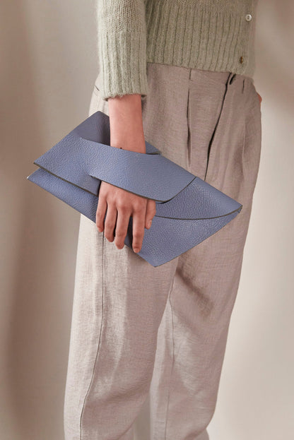 Handmade neutral grey blue genuine leather handbag, clutch purse with unique wrist strap by Hungarian, Budapest based designer.Bőr designer borítéktáska, magyar táskatervező márka.