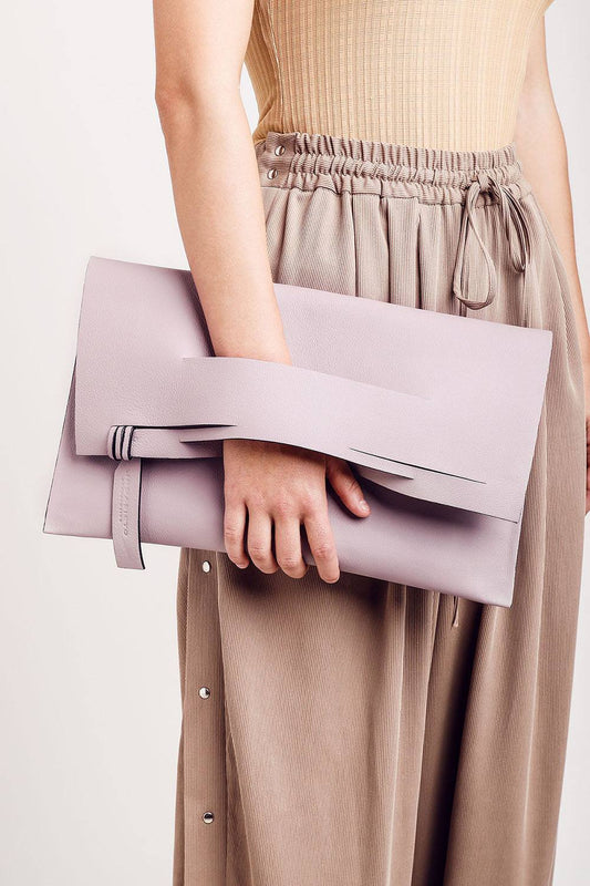 Handmade clutch bag handcrafted from genuine Italian leather, or vegan custom colors, black, neutral, light taupe handbag, crossbody purse with unique wrist strap, by Hungarian, Budapest EU based designer. Neutrális, taupe választható színű bőr designer borítéktáska, táska, válltáska magyar táskatervező márka.