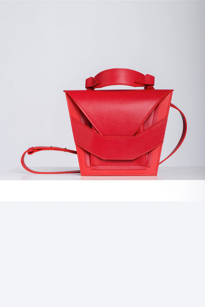 Lindasieto Layered Bag handcrafted from luxurious Italian red nappa leather, sculptural minimalist handbag, crossbody purse with unique wrist strap by Hungarian, Budapest based designer. Piros bőr kortárs designer válltáska magyar táska tervező márka.