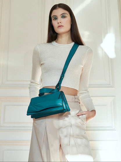 Lindasieto magyar designer türkiz kék bőr crossbody táska, egyedi, női, uniszex, iparművész válltáska, különleges színekben, személyre szabott monogram, ajándék csomagolással. Handmade genuine teal nappa leather crossbody bag by Budapest based fashion designer, unique wrist strap handle, gift wrap available. Limited quantities, ethical production.