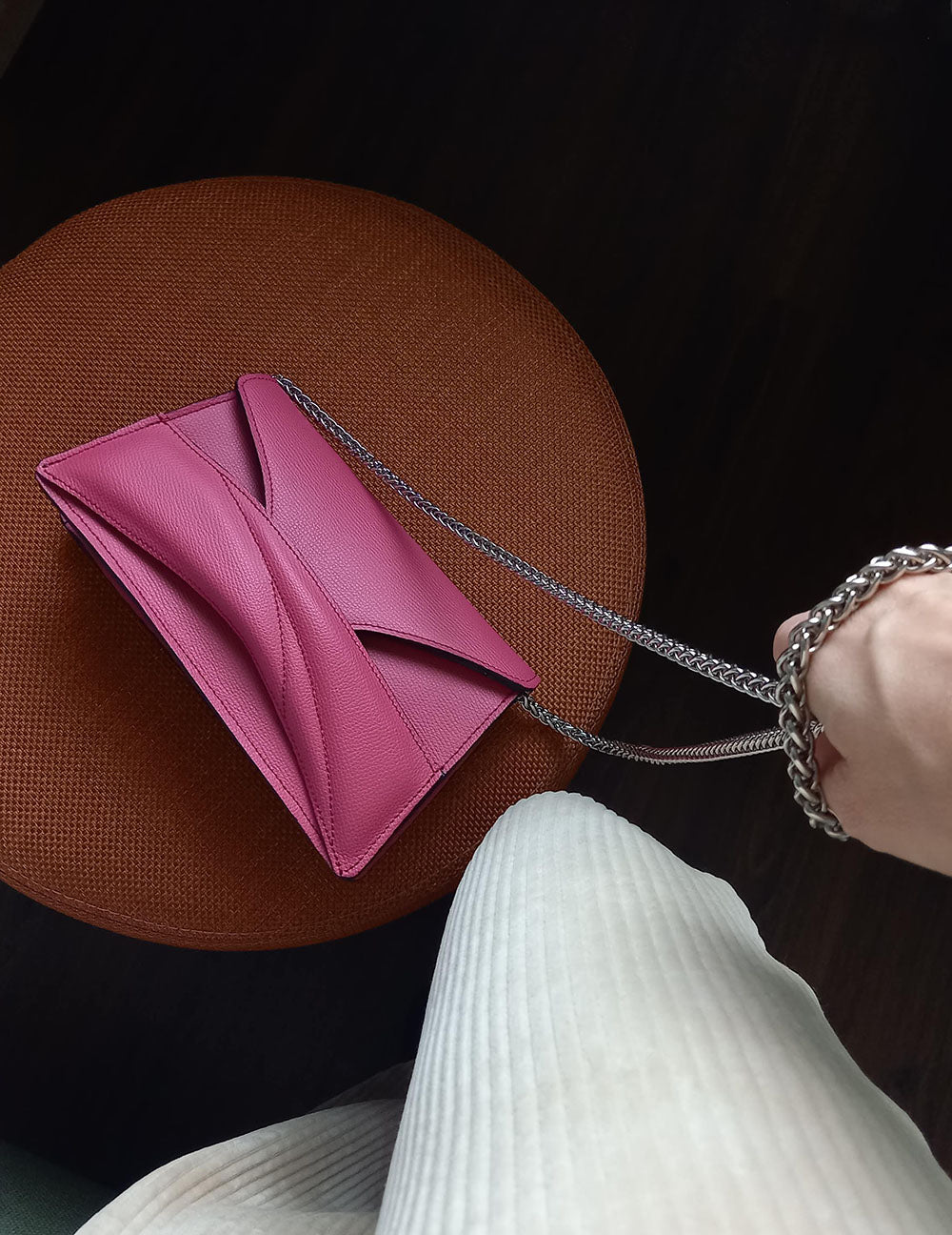 Handmade clutch bag handcrafted from genuine Italian leather, custom colors, pink red handbag, crossbody purse with unique wrist strap by Hungarian, Budapest based designer. Pink, választható színű bőr designer borítéktáska, táska, válltáska magyar táskatervező márka.