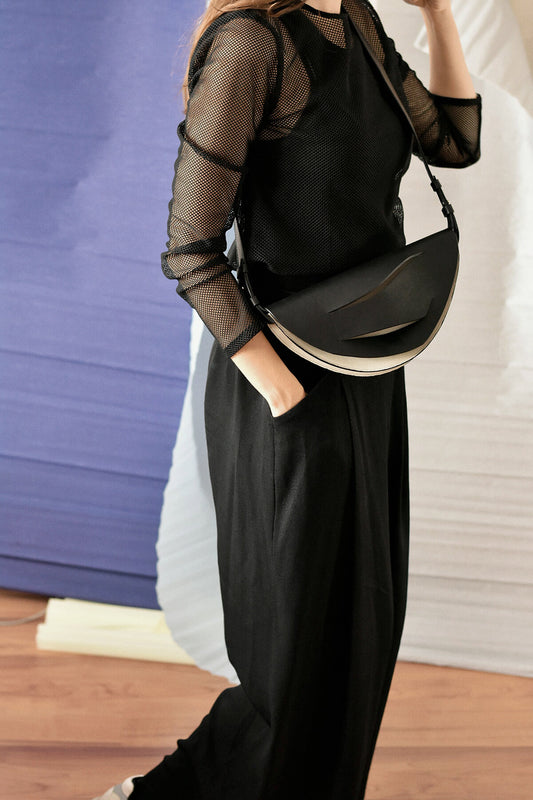 Handmade clutch bag handcrafted from genuine Italian leather, custom colors, black handbag, crossbody purse with unique wrist strap by Hungarian, Budapest based designer. Fekete bőr magyar designer borítéktáska, táska, válltáska, táska tervezői márka.