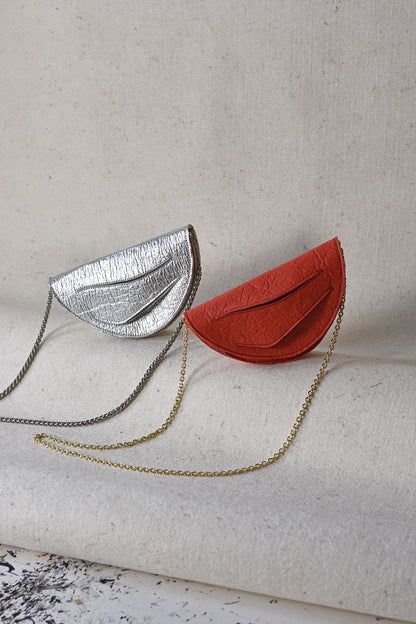 Handmade red silver vegan handbag, crossbody, clutch bag with unique wrist strap by Hungarian, Budapest based designer. Bőr designer válltáska, táska márka, magyar tervező.