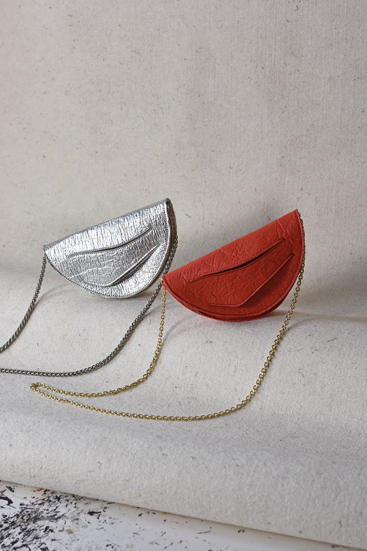 Handmade red silver vegan handbag, crossbody, clutch bag with unique wrist strap by Hungarian, Budapest based designer. Bőr designer válltáska, táska márka, magyar tervező.