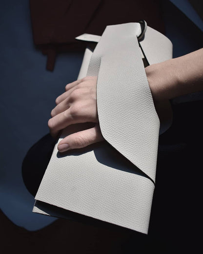 Handmade bridal clutch bag handcrafted from genuine Italian leather, custom colors, black, white handbag, purse with unique wrist strap by Hungarian, Budapest, EU based designer. Fehér, választható színű bőr designer borítéktáska, esküvő, menyasszony táska, magyar táskatervező márka.